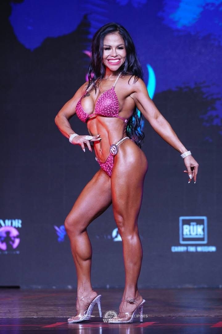 Jasmin in a side pose on stage