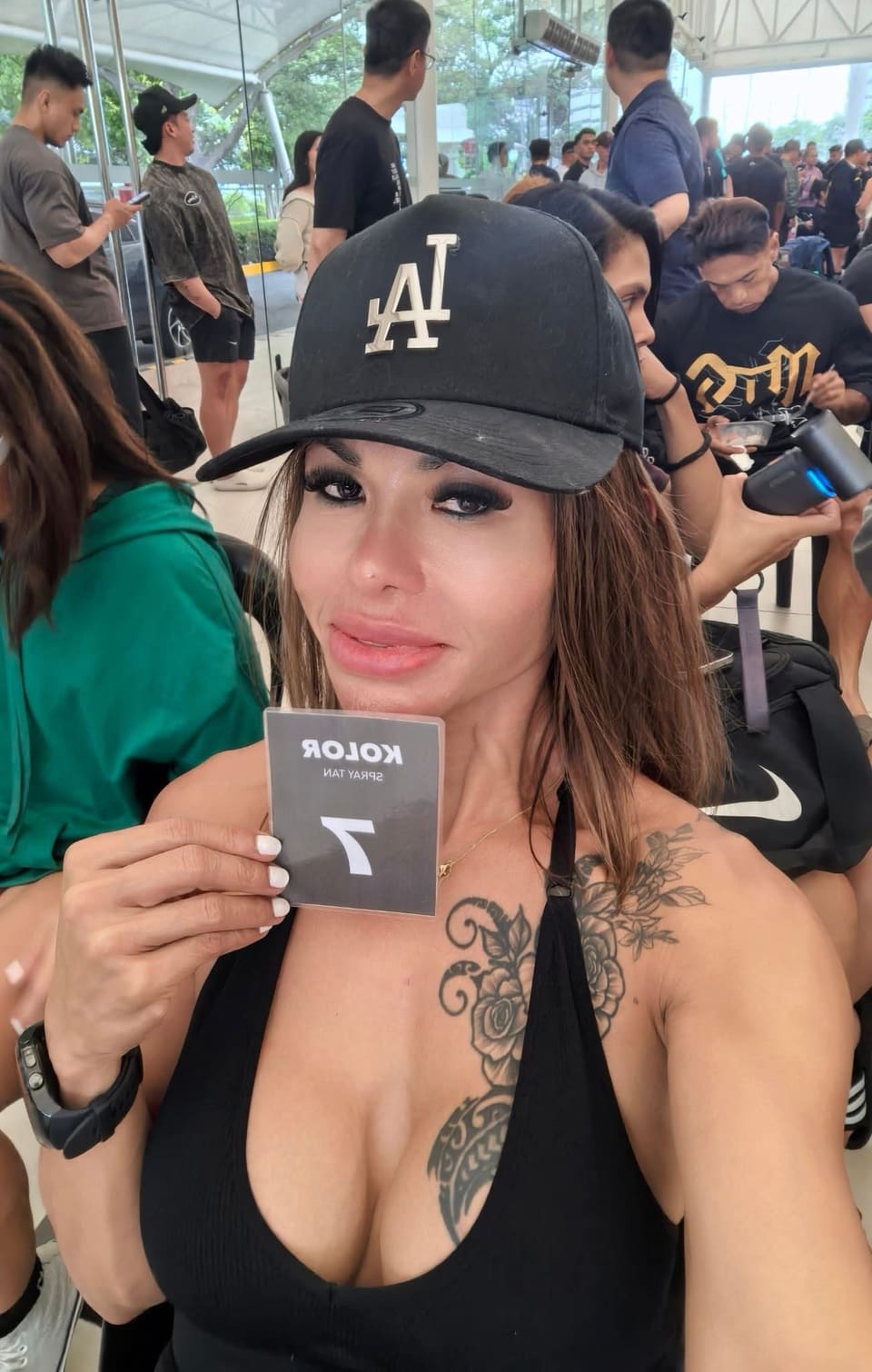 Jasmin backstage on show day holding her competitor number