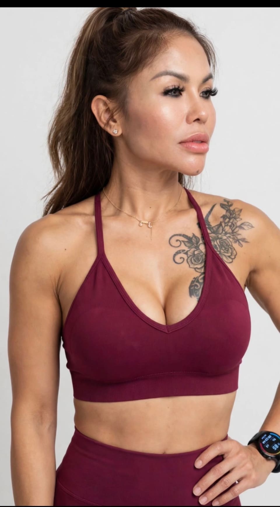 Studio portrait of Jasmin in a burgundy sports bra