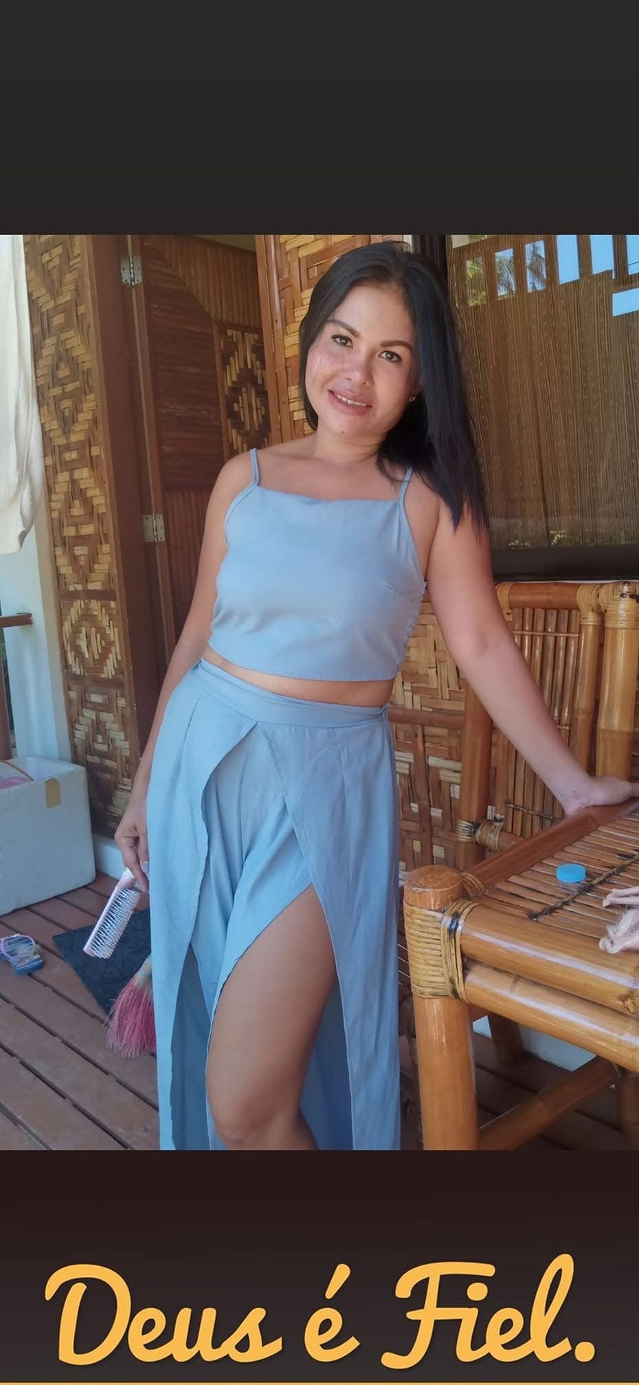 A relaxed portrait of Jasmin in a light blue outfit
